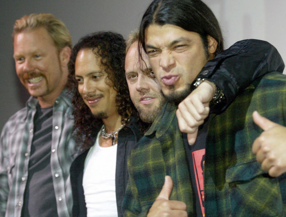 The US heavy metal band Metallica (from left to right): James Hetfield, Kirk Hemmet, Lars Ulrich und Robert Trujllo pose for their fans at Berlin's Cine-Star cinema theater 26 May 2003. The band introduced their new album 'St. Anger' which will be released 10 June.                          AFP PHOTO DDP/ROBERT MICHAEL     GERMANY OUT  (Photo credit should read ROBERT MICHAEL/AFP/Getty Images)