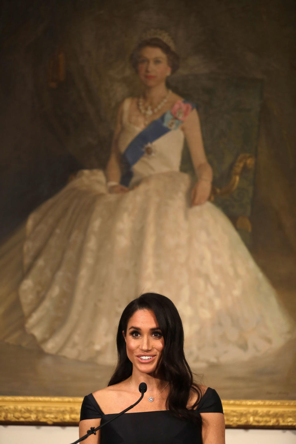 The Duchess of Sussex delivers the speech in front of a portrait of Queen Elizabeth II.&nbsp; (Photo: PA Wire/PA Images)