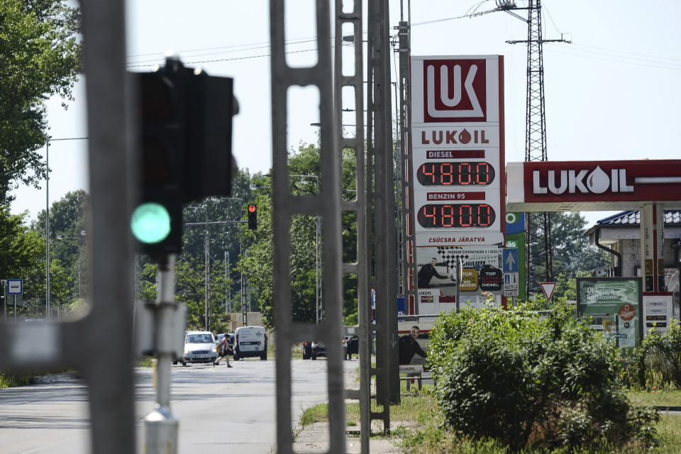 Discounted fuel prices are seen on a display of a petrol station, in Budapest, Hungary, Sunday, June 12, 2022. Hungary has placed price caps on fuel and some food and imposed special taxes on industries as the government tries to ease an economic downturn and the highest inflation in nearly 25 years. (AP Photo/Anna Szilagyi)