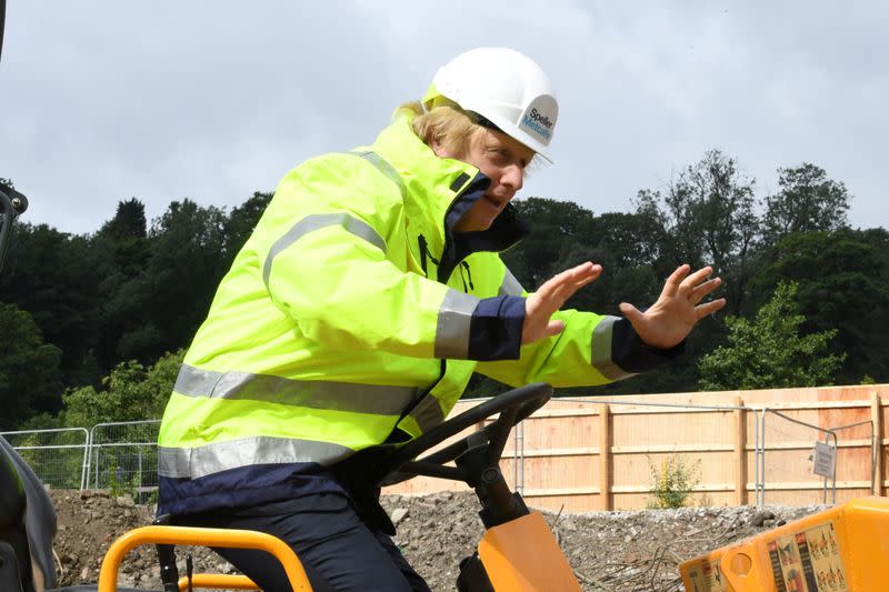 Britain's Prime Minister Boris Johnson gestures visits the Speller Metcalfe's building site in Dudley