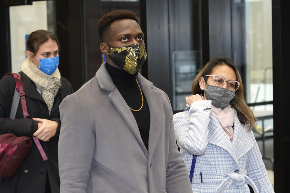 Abimbola "Able" Osundairo, and and his attorney Gloria Schmidt Rodriguez walk through the lobby of the Leighton Criminal Courthouse courtroom during a lunch break in the trial of actor Jussie Smollett Wednesday, Dec. 1, 2021, in Chicago. Osundairo is expected to testify in the trial of Smollett who is accused of lying to police when he reported he was the victim of a racist, anti-gay attack in downtown Chicago nearly three years ago, in Chicago. (AP Photo/Charles Rex Arbogast)