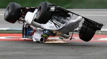 Williams Formula One driver Felipe Massa of Brazil crashes with his car in the first corner after the start of the German F1 Grand Prix at the Hockenheim racing circuit, in this July 20, 2014 file photo. REUTERS/Kai Pfaffenbach/Files (GERMANY - Tags: SPORT MOTORSPORT F1 TPX IMAGES OF THE DAY)