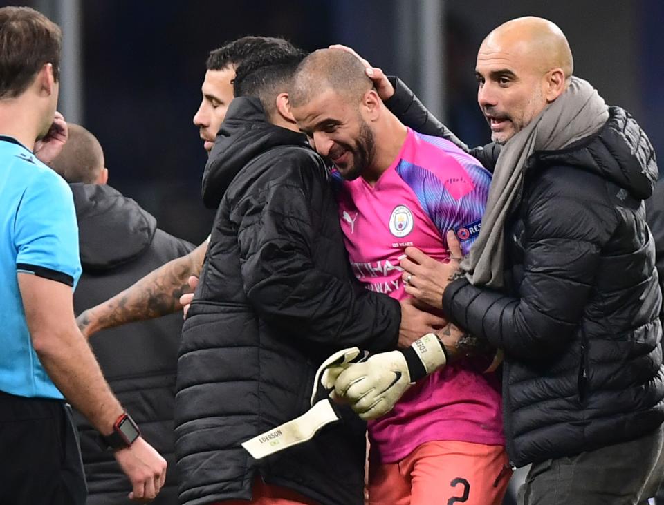 Manchester City's Spanish manager Pep Guardiola (R) congratulates Manchester City's English defender Kyle Walker who replaced the team's goalkeeper, at the end of the UEFA Champions League Group C football match Atalanta Bergamo vs Manchester City on November 6, 2019 at the San Siro stadium in Milan. (Photo by Miguel MEDINA / AFP) (Photo by MIGUEL MEDINA/AFP via Getty Images)