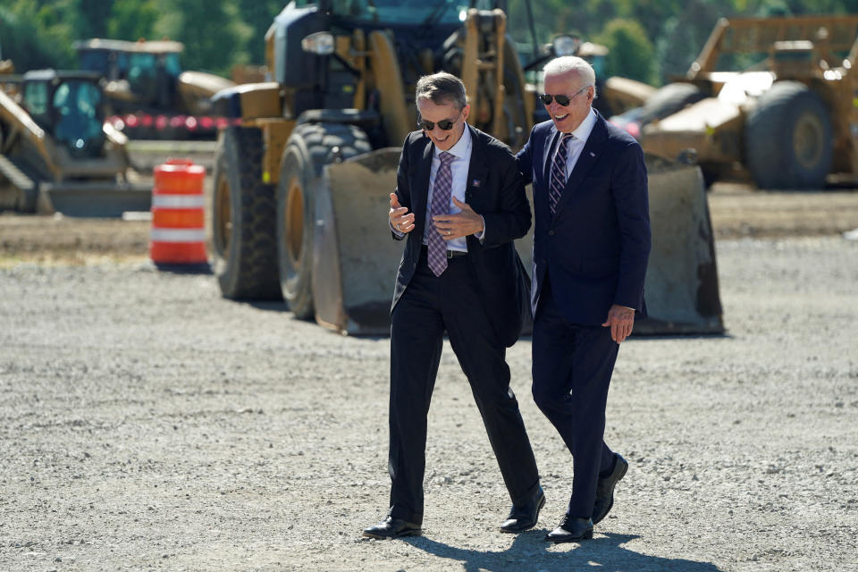 U.S. President Joe Biden walks with Intel CEO Pat Gelsinger as he attends the groundbreaking of the new Intel semiconductor manufacturing facility in New Albany, Ohio, U.S., September 9, 2022. REUTERS/Joshua Roberts