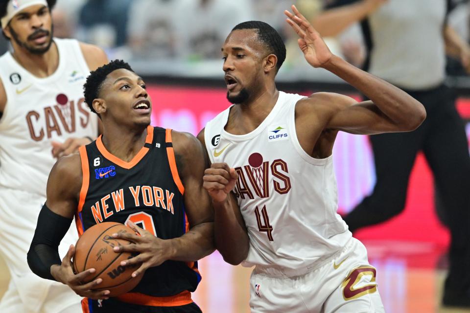 Knicks guard RJ Barrett drives to the basket against Cavaliers forward Evan Mobley (4) during the first quarter in Game 2 of a first-round playoff series, Tuesday, April 18, 2023, in Cleveland.