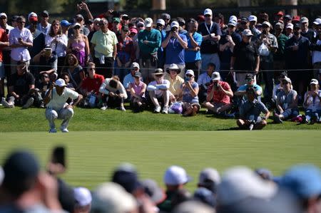 Feb 16, 2018; Pacific Palisades, CA, USA; Tiger Woods lines up a putt on the third green during the second round of the Genesis Open golf tournament at Riviera Country Club. Mandatory Credit: Orlando Ramirez-USA TODAY Sports