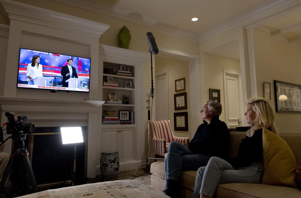 Jon Huntdman Jr. and his wife Mary Kaye watch the GOP presidential debate at their Salt Lake City home on Nov. 8, 2023.
