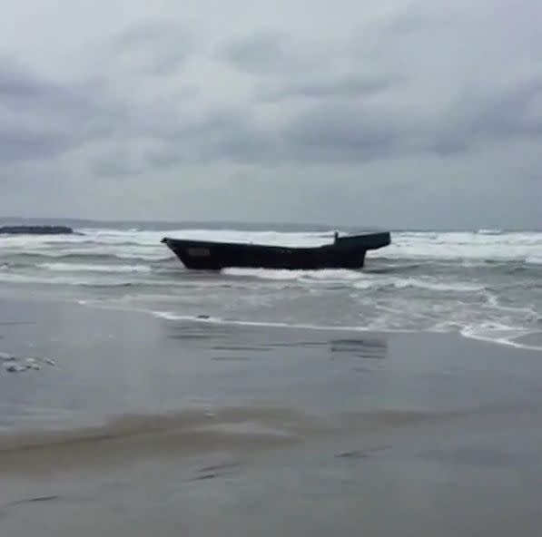 This ghost ship that washed ashore in Japan was found carrying eight bodies, authorities said. (Photo: Reuters)
