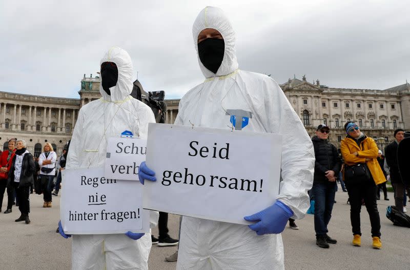 Demonstrators gather to protest against restrictions in Vienna