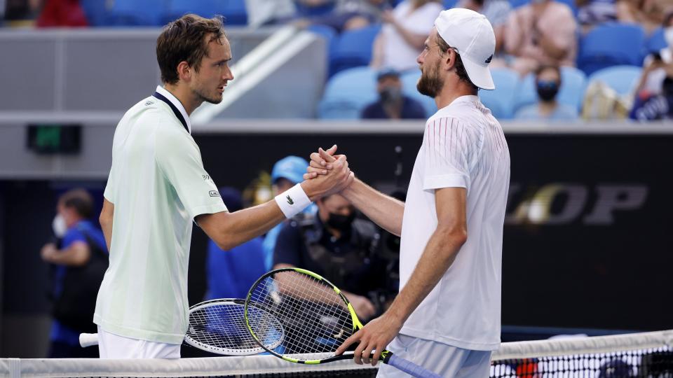 Daniil Medvedev of Russia, left, shakes hands with Maxime Cressy of the U.S., following their round of 16 match at last month's Australian Open.  After winning the match, Medvedev said the onrushing American’s game was, “lucky and so boring.”