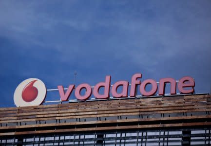 The Vodafone logo can be seen on top of a building outside Madrid, Spain, April 13, 2016. REUTERS/Andrea Comas