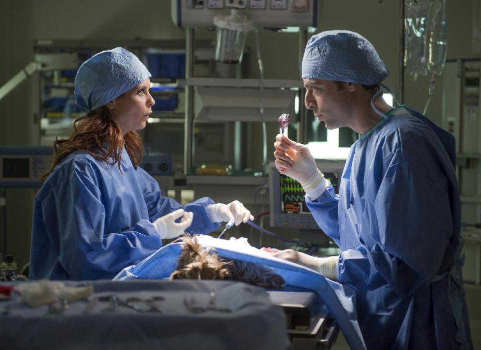 This undated image released by NBC shows Joanna Garcia Swisher as Dorothy Crane, left, and Justin Kirk portraying George Coleman in a scene from the pilot episode of "Animal Practice." Sneak peeks of NBC's new prime-time schedule will piggyback on network coverage of the 2012 Summer Olympic Games. The unveiling will begin with commercial-free sneak previews of NBC's new comedies "Go On" on Aug. 8, after the evening's Olympics coverage, and of "Animal Practice" on Aug. 12, following the Olympics' Closing Ceremonies. (AP Photo/NBC, Neil Jacobs)