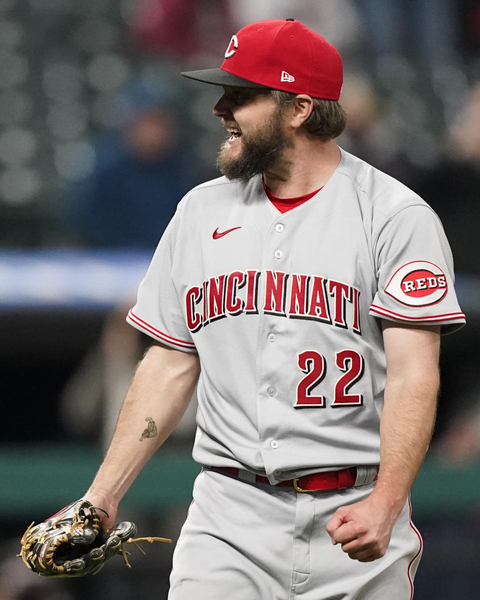 Cincinnati Reds starter Wade Miley pumps his fist as he starts to celebrate after pitching a no-hitter in a baseball game against the Cleveland Indians, Friday, May 7, 2021, in Cleveland. (AP Photo/Tony Dejak)