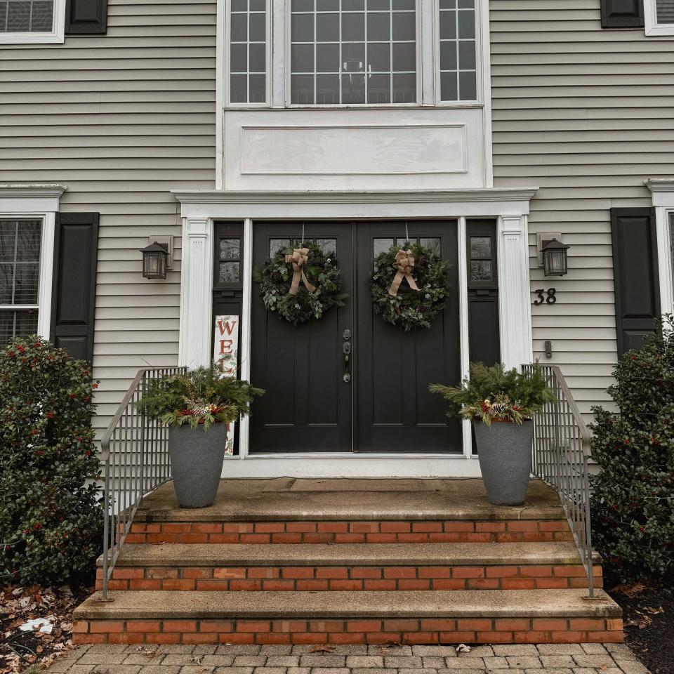 A holiday porch design by SouthCoast Pumpkin Co.