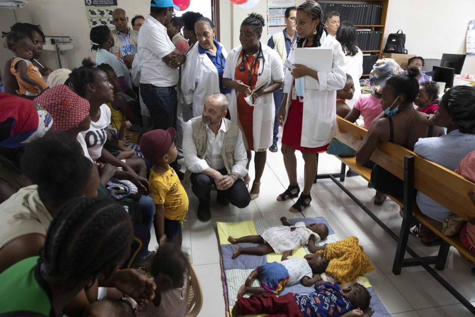 Manuel Fontaine, director of UNICEF's Office of Emergency Programmes, speaks with the families of babies suffering from symptoms of malnutrition during his visit to the Gheskio Center in Port-au-Prince, Haiti, Monday, Nov. 21, 2022. (AP Photo/Odelyn Joseph)