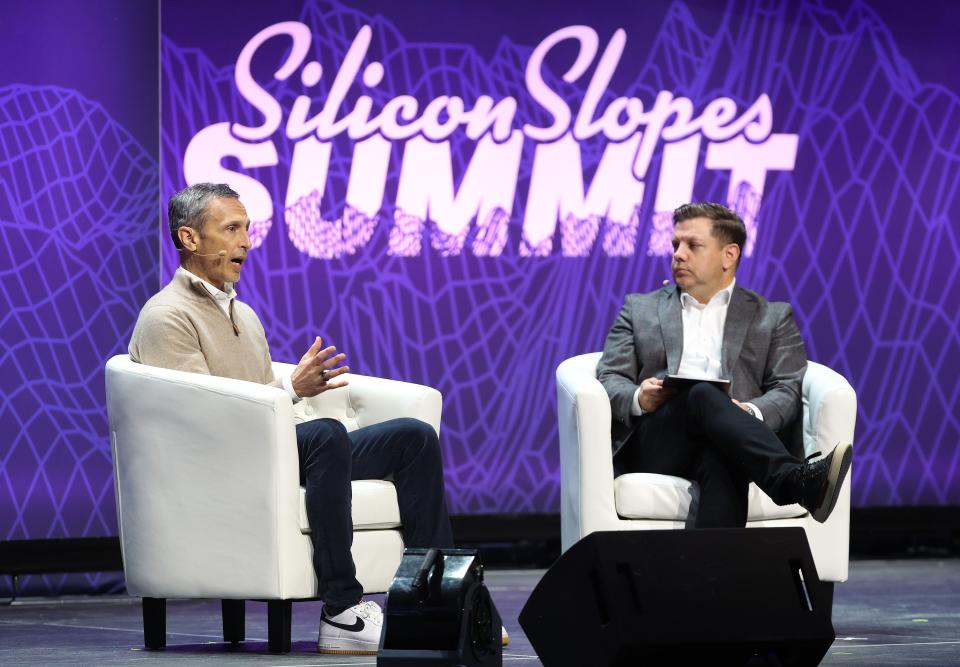 Jimmy Pitaro, chairman of ESPN, and Steve Starks, the CEO of Larry H. Miller Company, speak during the eighth annual Silicon Slopes Summit at the Delta Center in Salt Lake City on Wednesday, Sept. 27, 2023. | Jeffrey D. Allred, Deseret News