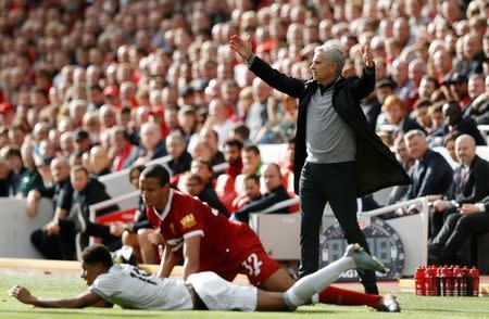 Soccer Football - Premier League - Liverpool vs Manchester United - Anfield, Liverpool, Britain - October 14, 2017 Manchester United manager Jose Mourinho reacts as Marcus Rashford and Liverpool's Joel Matip are down Action Images via Reuters/Carl Recine