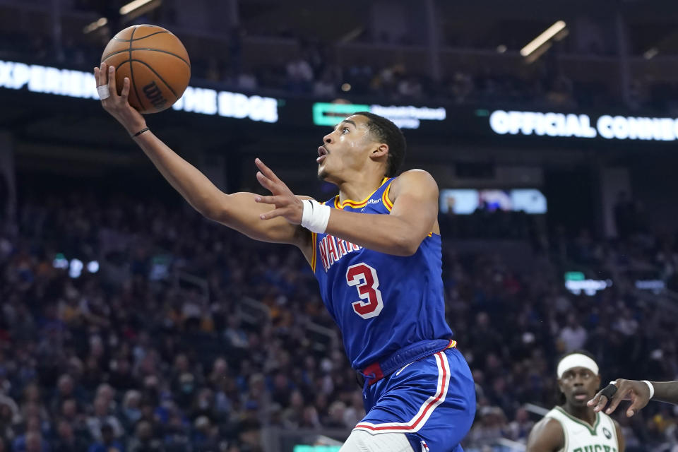 Golden State Warriors guard Jordan Poole (3) shoots against the Milwaukee Bucks during the first half of an NBA basketball game in San Francisco, Saturday, March 12, 2022. (AP Photo/Jeff Chiu)