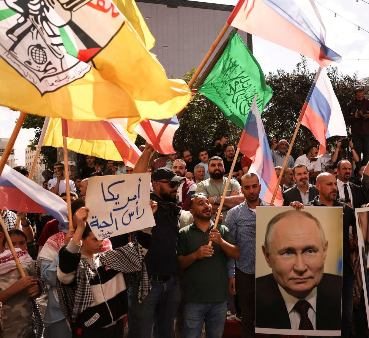 People wave Russian, Palestinian and Hamas flags. <a href="https://www.gettyimages.com/detail/news-photo/people-wave-russian-palestinian-fatah-and-hamas-flags-and-news-photo/1734736098?adppopup=true" rel="nofollow noopener" target="_blank" data-ylk="slk:Hazem Bader/AFP via Getty Images);elm:context_link;itc:0;sec:content-canvas" class="link ">Hazem Bader/AFP via Getty Images)</a>