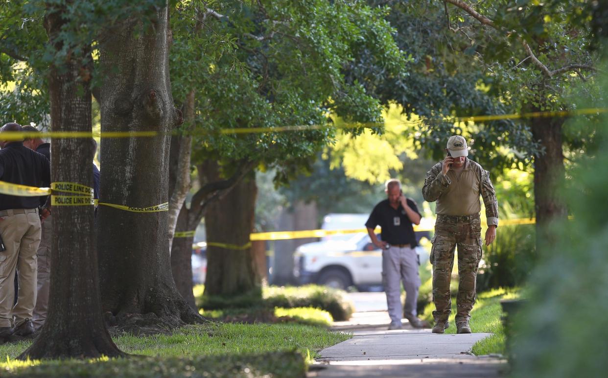 FBI, Bureau of Alcohol, Tobacco, Firearms and Explosives, and Houston Police work at the scene of a "law enforcement operation" led by the FBI in Houston: Godofredo A. Vasquez/Houston Chronicle via AP