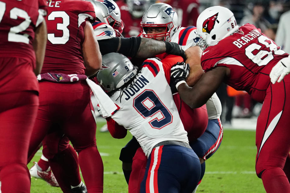 New England Patriots linebacker Matthew Judon (9) sacks Arizona Cardinals quarterback Colt McCoy during the first half of an NFL football game, Monday, Dec. 12, 2022, in Glendale, Ariz. (AP Photo/Darryl Webb)