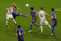 Croatia's Ivan Perisic, left, scores his side's opening goal during the World Cup round of 16 soccer match between Japan and Croatia at the Al Janoub Stadium in Al Wakrah, Qatar, Monday, Dec. 5, 2022. (AP Photo/Luca Bruno)