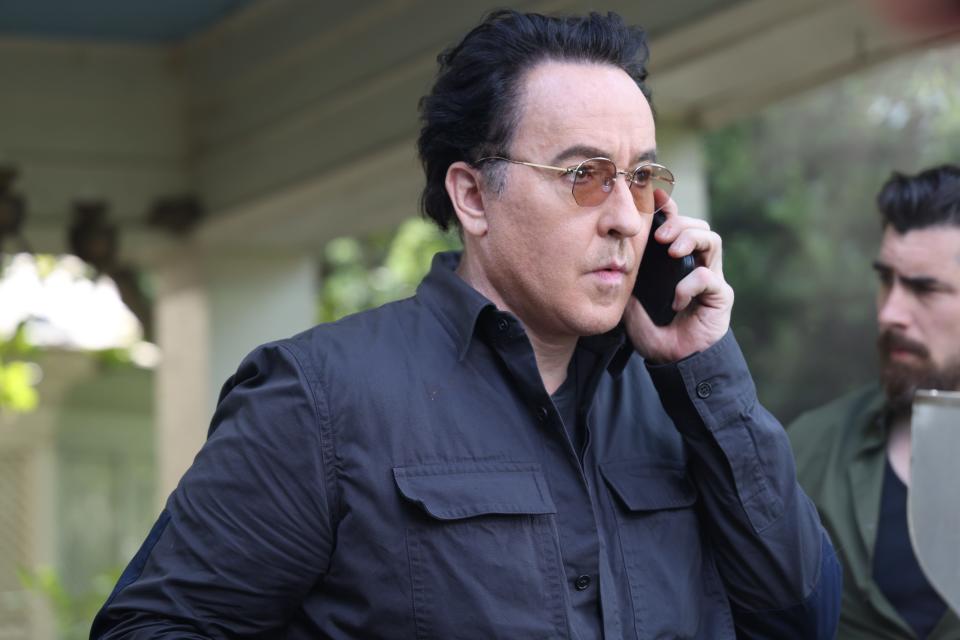 Actor John Cusack pictured in the 2022 movie "Pursuit," has tweeted his support of Asheville Blade reporters convicted of trespassing while covering police activity in Aston Park on Christmas Day 2021.