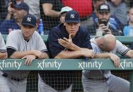 New York Yankees' Aaron Judge, center, watches from the dugout during the ninth inning of a baseball game against the Boston Red Sox in Boston, Saturday, Aug. 4, 2018. (AP Photo/Michael Dwyer)