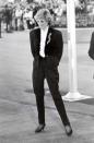 <p>One of Princess Diana’s most iconic outfits was a black evening suit worn at a pop gala in Vancouver. The androdynous look was unseen at the time, yet these days, trousers suits have beocme a stapel part of women’s wardrobes. <em>[Photo: Rex]</em> </p>