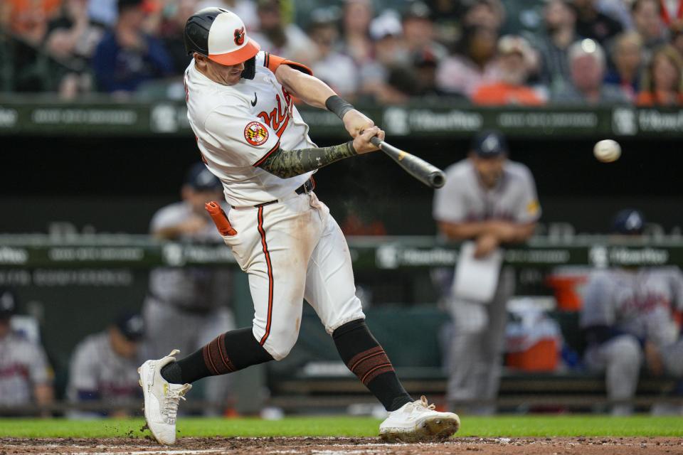 Baltimore Orioles' Austin Hays hits an RBI-single against the Atlanta Braves during the sixth inning of a baseball game, Tuesday, June 11, 2024, in Baltimore. (AP Photo/Jess Rapfogel)