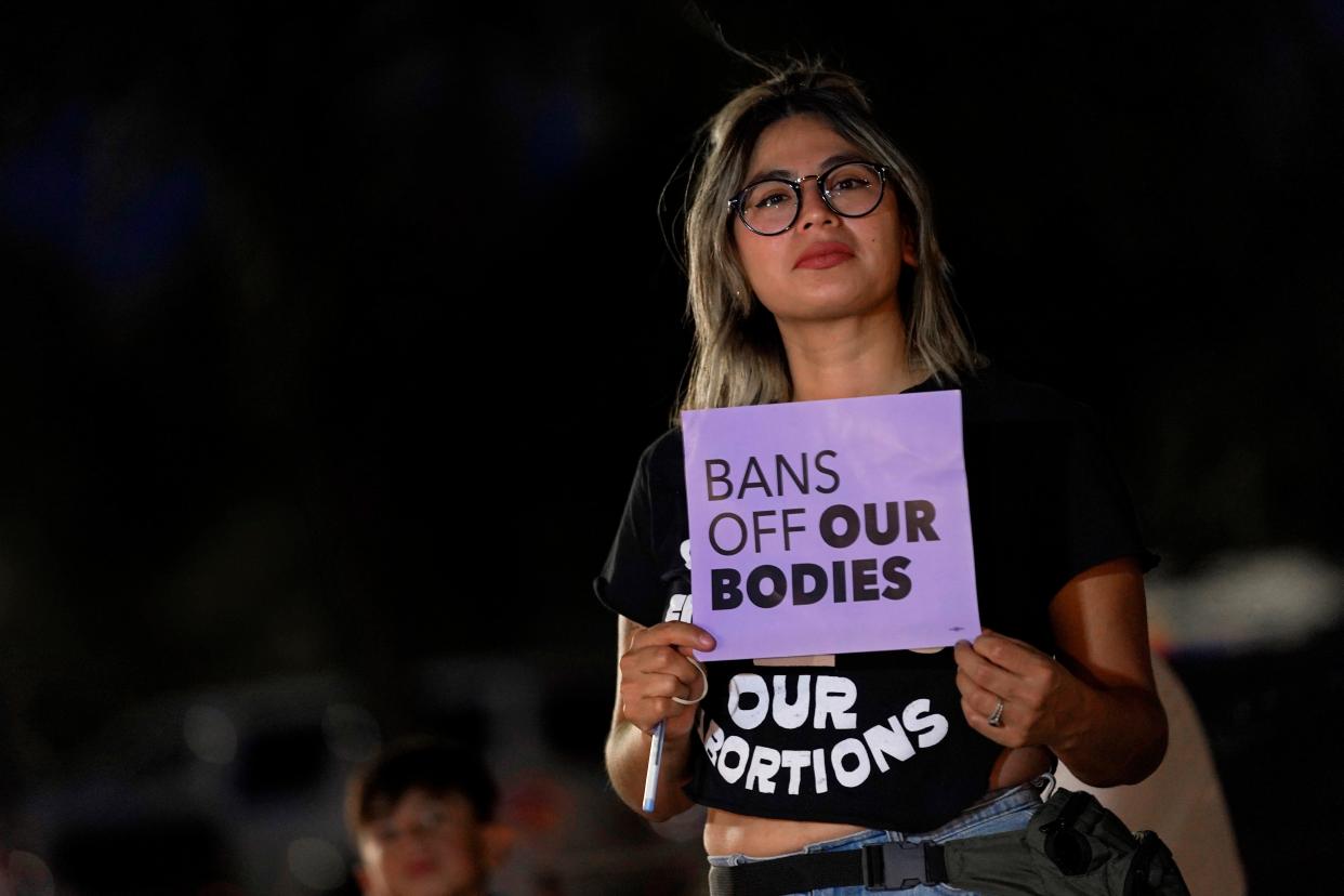 Celina Washburn voices her opposition to an abortion ruling outside the Arizona Capitol in Phoenix on Sept. 23, 2022. The Arizona Supreme Court may soon decide which of two state abortion laws is in effect.
