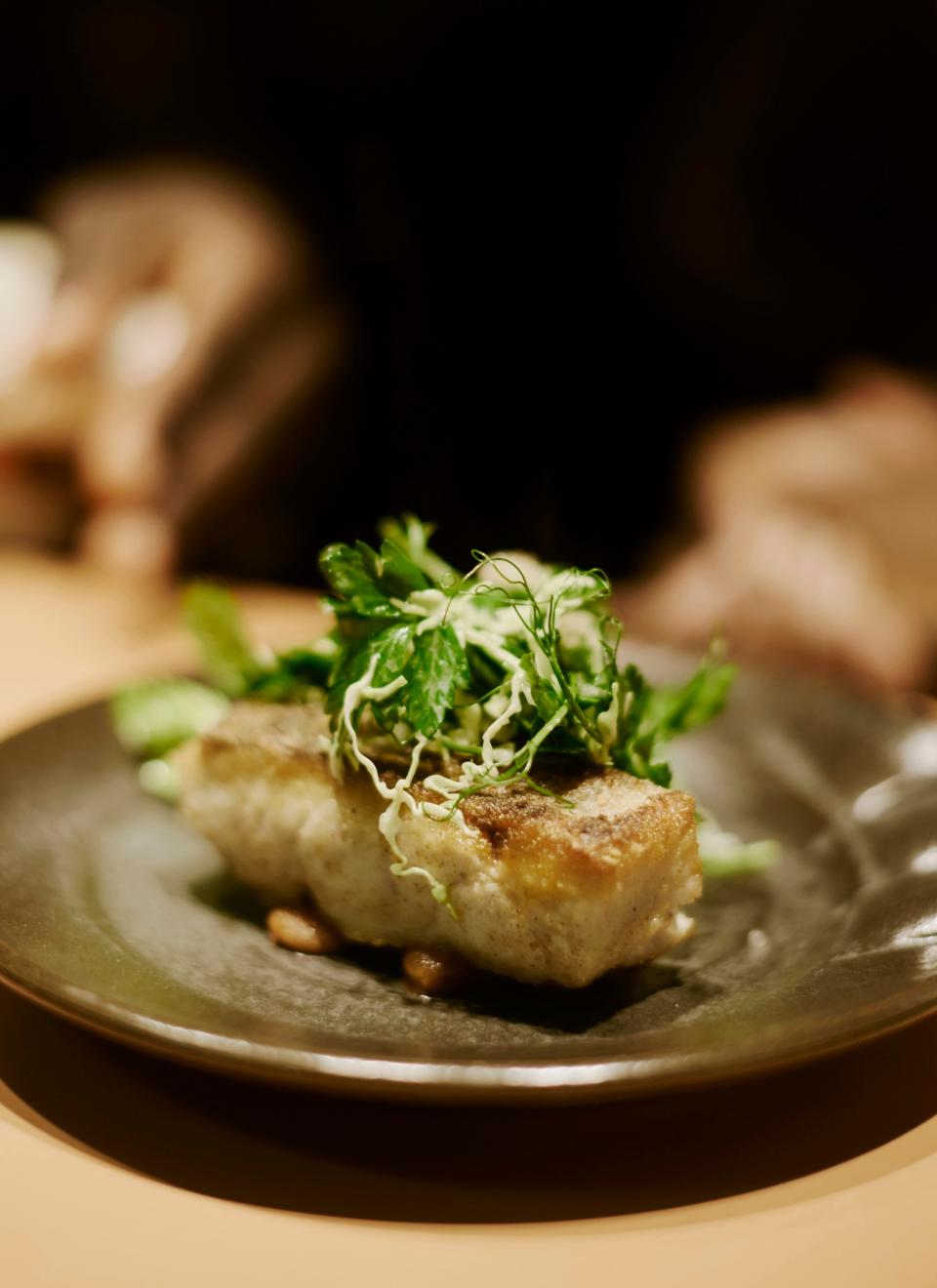 A meal at Dakar NOLA might include cornmeal-crusted flounder with fresh herbs.