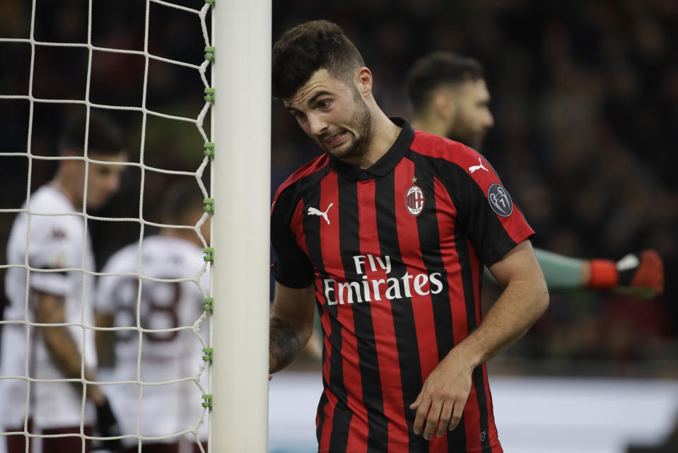 AC Milan's Patrick Cutrone grimaces after missing a scoring chance during a Serie A soccer match between AC Milan and Torino , at the San Siro stadium in Milan, Italy, Sunday, Dec. 9, 2018. (AP Photo/Luca Bruno)