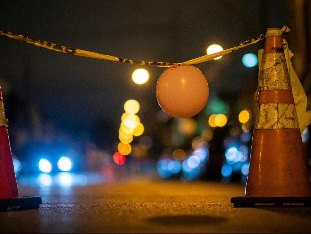 A makeshift temporary barrier created by activists is placed in the street near the 18th Precinct Police Department during a citywide curfew on 28 October 28 in Philadelphia (Getty Images)