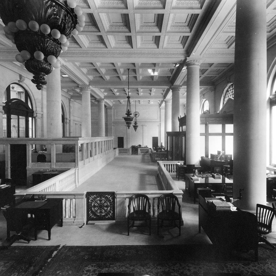 <p>An interior photo of the Grace and Co. Bank shows off the vast size of the New York City bank—complete with marbled columns. </p>