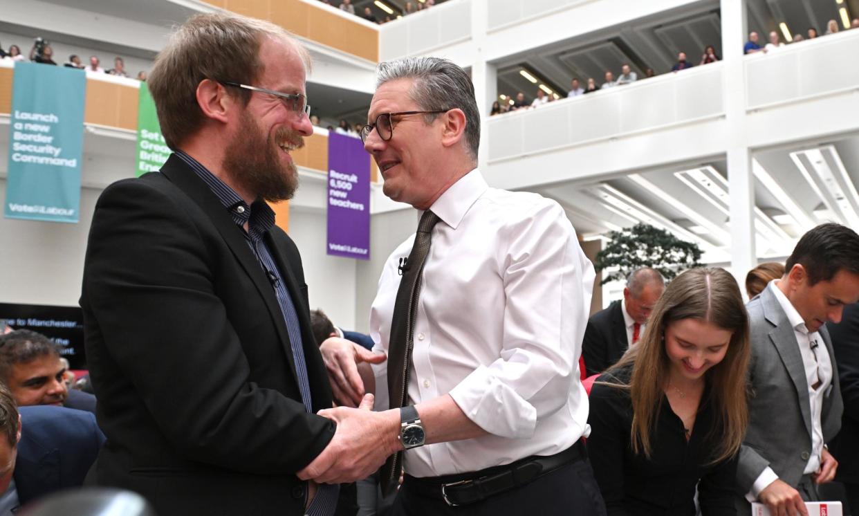 <span>Keir Starmer with Nathaniel Dye during the launch of Labour's general election manifesto on 13 June.</span><span>Photograph: Anthony Devlin/Getty Images</span>