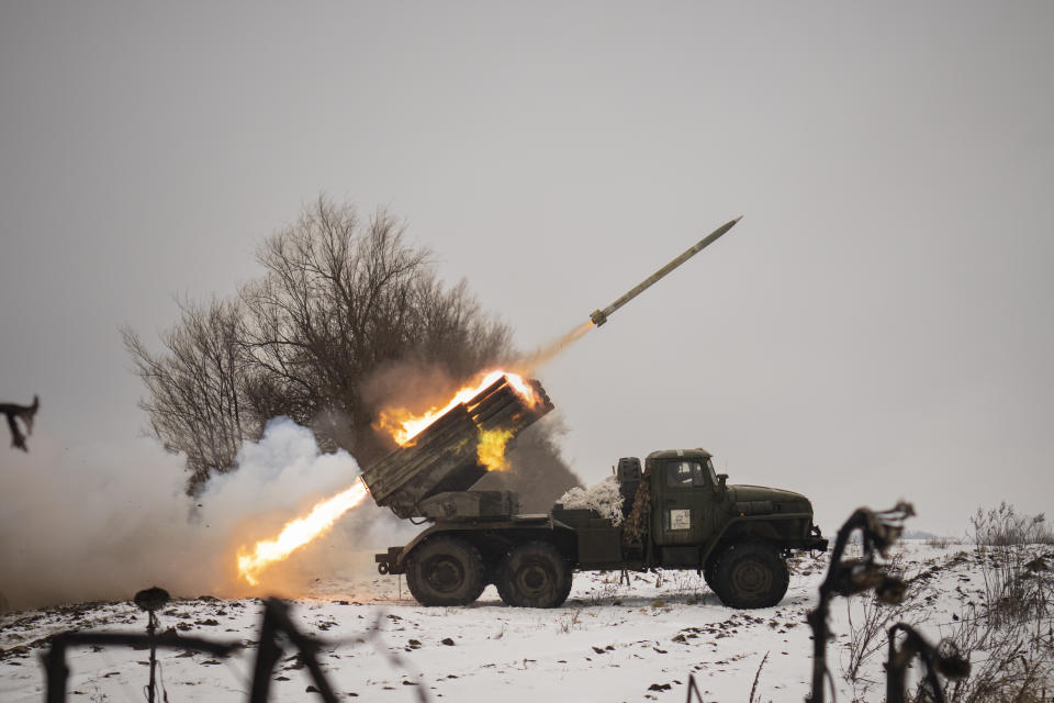 Ukrainian military fires from a multiple rocket launcher at Russian positions in the Kharkiv area, Ukraine, Saturday, Feb. 25, 2023. The Biden administration declared its Ukraine solidarity with fresh action as well as strong words on Friday, piling sweeping new sanctions on Moscow and approving a new $2 billion weapons package to re-arm Kyiv a year after Russia's invasion. (AP Photo/Vadim Ghirda)