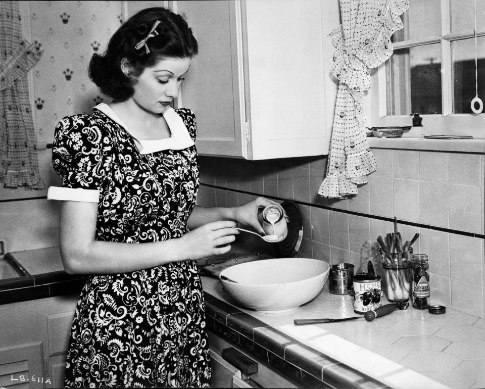 <p>The <em>I Love Lucy </em>star bakes in her Los Angeles kitchen.</p>