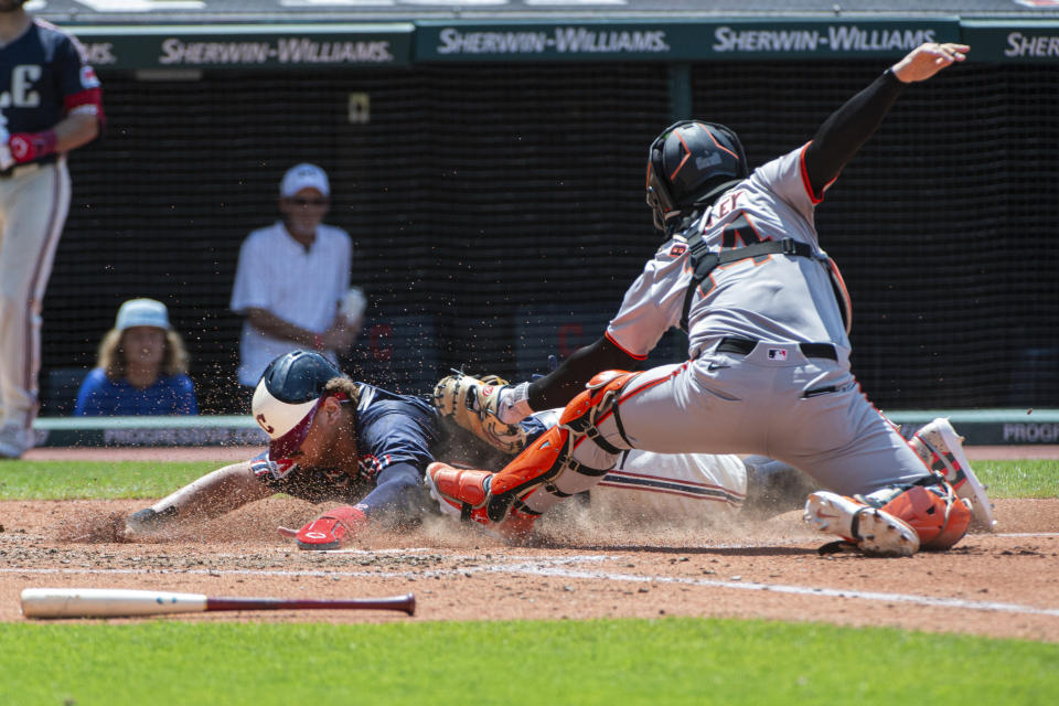 San Francisco Giants' Patrick Bailey, right, tags out Cleveland Guardians' Josh Naylor, left, at home plate during the fourth inning of a baseball game in Cleveland, Sunday, July 7, 2024. (AP Photo/Phil Long)