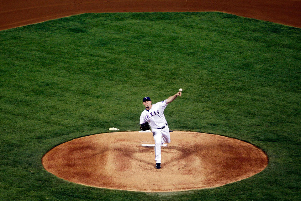 ARLINGTON, TX - OCTOBER 22: Matt Harrison #54 of the Texas Rangers pitches in the second inning during Game Three of the MLB World Series against the St. Louis Cardinals at Rangers Ballpark in Arlington on October 22, 2011 in Arlington, Texas. (Photo by Tom Pennington/Getty Images)