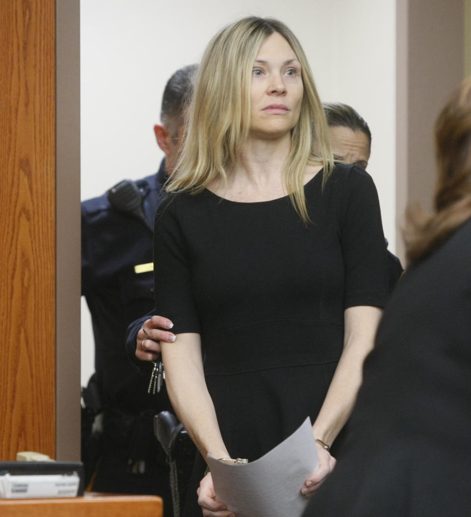 FILE - This Feb. 14, 2013 file photo shows Amy Locane Bovenizer entering the courtroom to be sentenced in Somerville, N.J. for the 2010 drunk driving accident in Montgomery Township that killed 60-year-old Helene Seeman. Locane was sentenced Friday, Feb. 15, 2019, to 5 years behind bars. She served about 2½ years before her 2015 release. An appeals court ordered Locane to be re-sentenced after determining her initial sentence was too lenient. (AP Photo/The Star-Ledger, Patti Sapone, File)