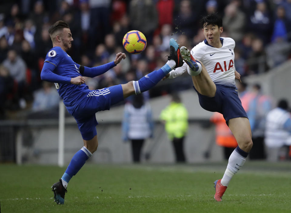 Leicester City's James Maddison, left, vies for the ball with Tottenham Hotspur's Son Heung-min during the English Premier League soccer match between Tottenham Hotspur and Leicester City at Wembley stadium in London, Sunday, Feb. 10, 2019. (AP Photo/Matt Dunham)