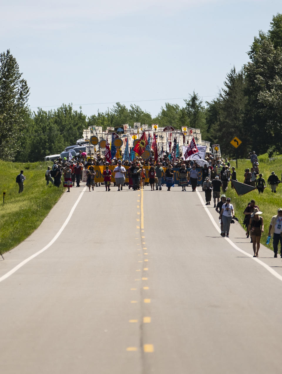 More than 2,000 Indigenous leaders and "water protectors" from around the country march along Highway 9 in Clearwater County, Minn., on Monday, June 7, 2021, in Clearwater County, Minn., to protest the construction of Enbridge Line 3. (Alex Kormann/Star Tribune via AP)