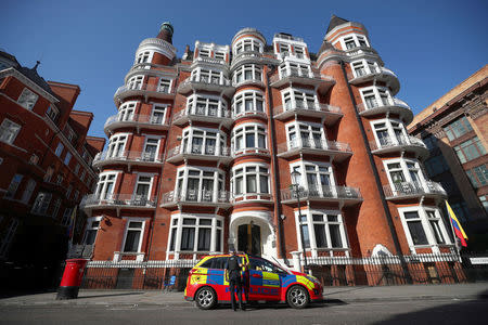 A police officer parks their car outside the Ecuadorian embassy, where Julian Assange remains inside, in central London, Britain, July 23, 2018. REUTERS/Hannah McKay