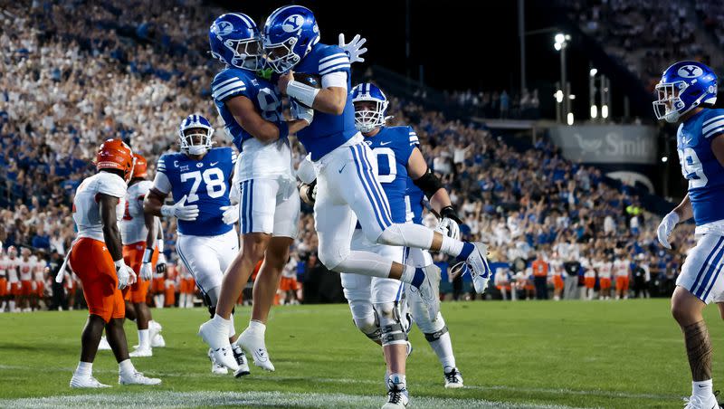 BYU wide receiver Parker Kingston and quarterback Kedon Slovis celebrate after Slovis scored a touchdown, putting BYU up 7-0 after the PAT, during the game against the Sam Houston Bearkats at LaVell Edwards Stadium in Provo on Saturday, Sept. 2, 2023.
