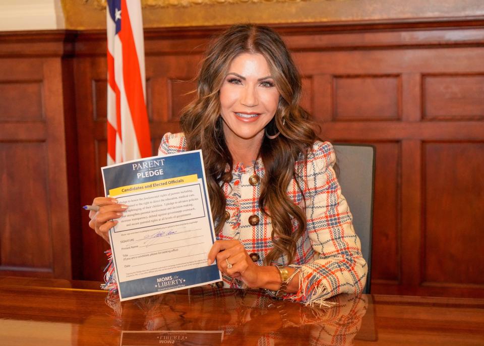 Gov. Kristi Noem tweeted this image from her campaign account Thursday, April 27, 2023, showing she signed a pledge written by conservative political action committee Moms for Liberty.