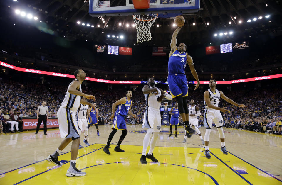 Golden State Warriors' Andre Iguodala (9) drives for a dunk against the Memphis Grizzlies during the first half of an NBA basketball game Sunday, March 26, 2017, in Oakland, Calif. (AP Photo/Marcio Jose Sanchez)