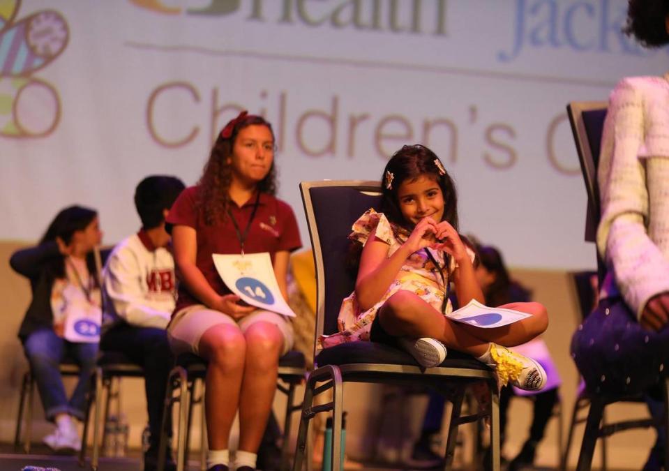 Judie ElAttar, 8, a second-grader at David Fairchild Elementary, top right, was one of the youngest competitors Wednesday in the 83rd annual Miami Herald Spelling Bee for Miami-Dade and Monroe students. A total of 26 students competed.