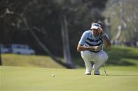 Feb 16, 2014; Pacific Palisades, CA, USA; Bubba Watson (USA) lines up a putt on the seventh green during the fourth round of the Northern Trust Open at Riviera Country Club. Andrew Fielding-USA TODAY Sports
