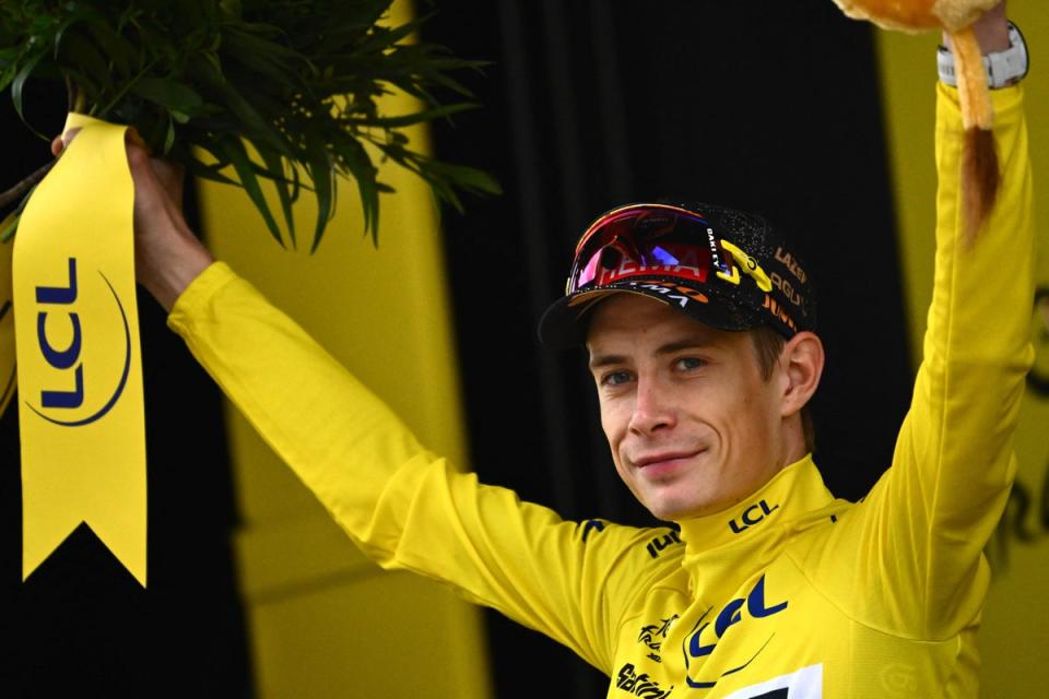 Jonas Vingegaard celebrates wearing the yellow jersey (AFP via Getty Images)